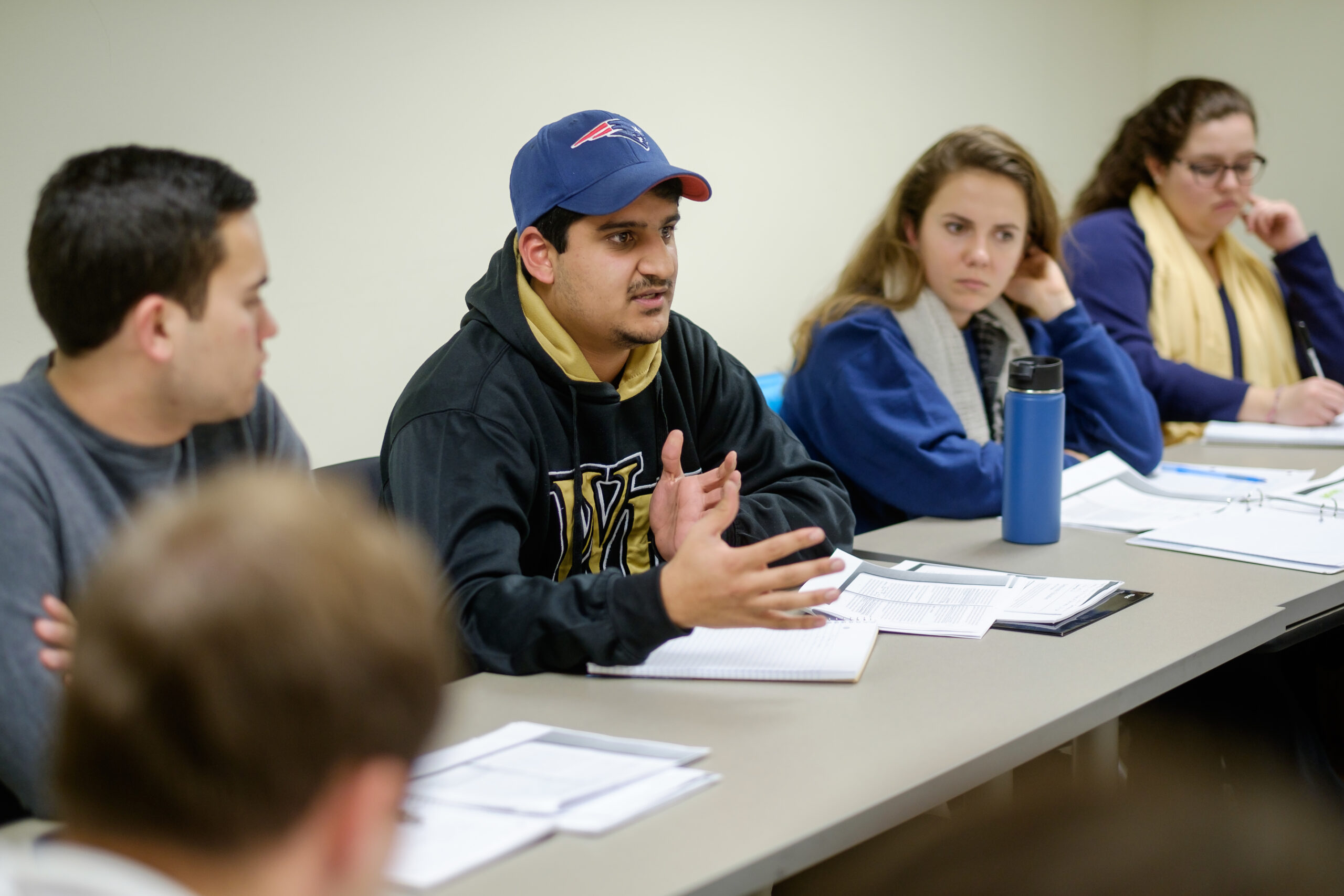 Wake Forest senior political science majors discuss education policy in Katy Harriger's seminar class in Kirby Hall on Thursday, January 21, 2016. Karan Bakshi ('16) makes a point during the discussion.