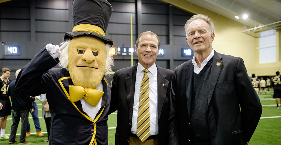 Bob McCreary (right) with AD Ron Wellman and the Demon Deacon