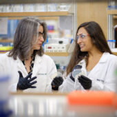 A student works with professor Rebecca Alexander.