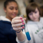 Students conduct a science experiment