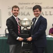 Wake debaters holding ACC trophy