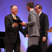 Wake Forest President Dr. Nathan Hatch receives an award from Wheaton College