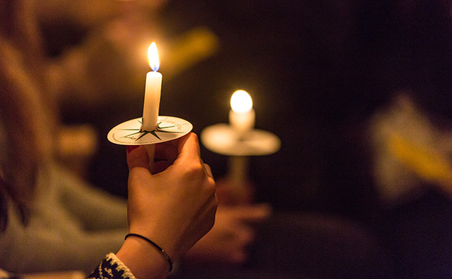 Students light candles at Wake Forest University.