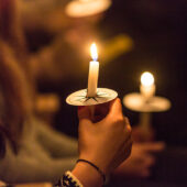 Students light candles at Wake Forest University.