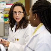 Wake Forest chemistry professor Patricia Dos Santos works with graduate students Ashley Edwards, Maame Addo, and Canna Zheng in her lab at Wake Downtown.