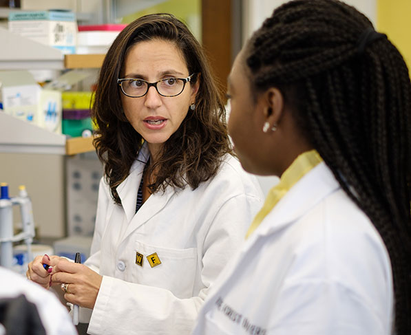 Wake Forest chemistry professor Patricia Dos Santos works with graduate students Ashley Edwards, Maame Addo, and Canna Zheng in her lab at Wake Downtown.