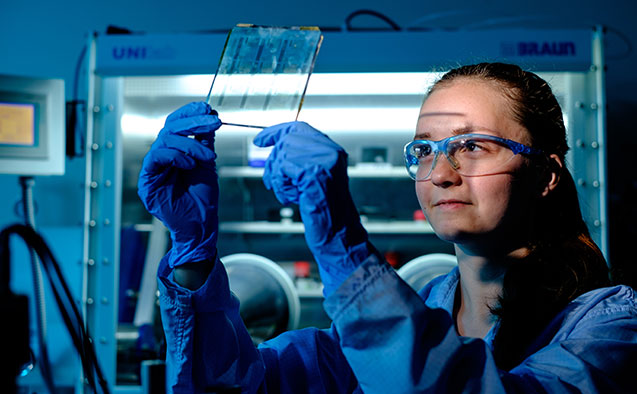 Wake Forest junior Angela Harper works in her physics lab .