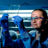 Wake Forest junior Angela Harper works in her physics lab .