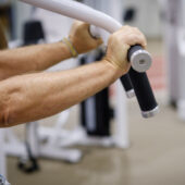 Stock image of a patient lifting weights