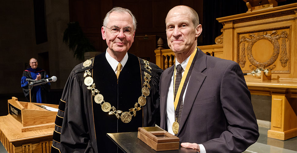 Wake Forest President Nathan O. Hatch presents Medallion of Merit to Mike Ford