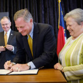 Richard Burr signs paper