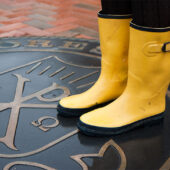 A student at Wake Forest wears rain boots on Hearn Plaza.