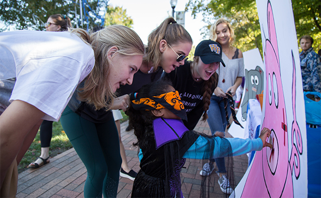 Wake Forest students host local elementary school students on campus for Project Pumpkin, a Halloween celebration, on Wednesday, October 26, 2016.