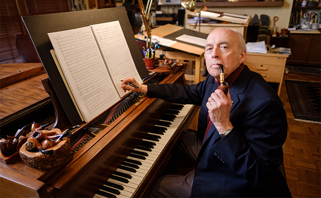 Wake Forest music professor and composer Dan Locklair poses in his studio at his home in Winston-Salem on Monday, July 2, 2018.