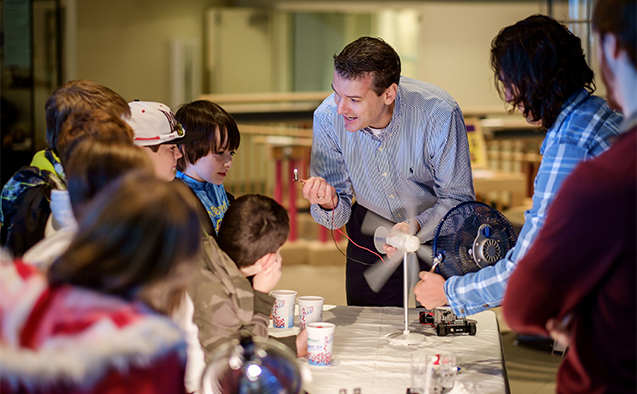 Thonhauser and graduate students demonstrated alternative energy sources to elementary school students at SciWorks (now Kaleideum North) in 2014.