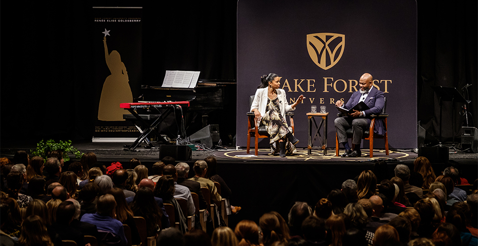 Goldsberry talks with Wake Forest School of Divinity professor Derek Hicks as part of the Arts of Leading conference.