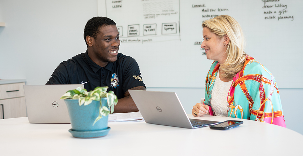 Ja’Cquez Williams works alongside Kate Reece, executive director of the Center for Private Business.