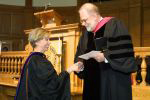 Kathleen Kron, left, receives research award from Dean Gordon Melson