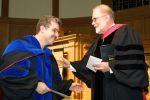 James Schirillo, left, receives research award from Dean Gordon Melson