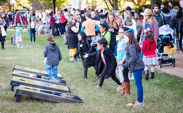 Wake Forest students host children from local elementary schools for a Halloween party on the quad during the annual volunteer service event Project Pumpkin, on Hearn Plaza on Wednesday, October 24, 2018.