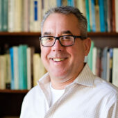 Wake Forest political science professor Peter Siavelis poses in his office in Kirby Hall on Wednesday, April 10, 2019.