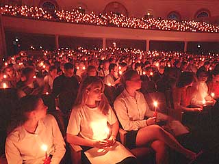 Participants with candles at Christmas lovefeast