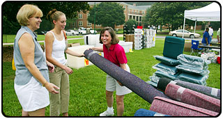 From left, Sharon Claffey and her daughter, incoming freshman Katie Claffey '07, buy a rug.