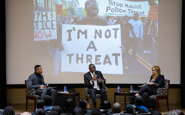 Civil rights attorney Benjamin Crump greets Maya Angelou Presidential Chair Melissa Harris Perry in Pugh Auditorium on Wednesday, February 12, 2020.