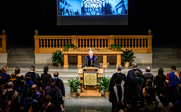 Wake Forest president Nathan Hatch speaks at the lectern