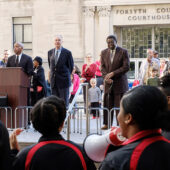 WSSU Chancellor Dr. Elwood Robinson, WFU President Dr. Nathan O. Hatch, and original sit-in protestor Victor Johnson, Jr., lead the memorial at the sit-in site.