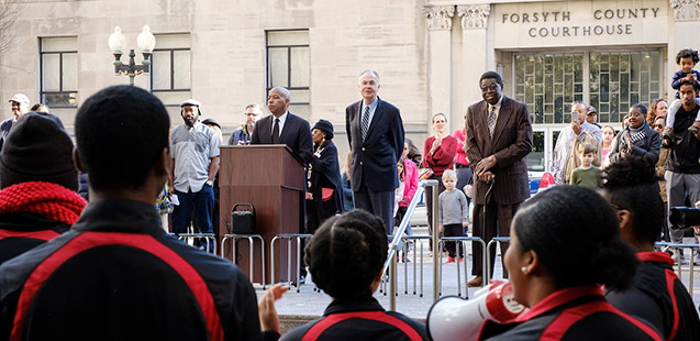 WSSU Chancellor Dr. Elwood Robinson, WFU President Dr. Nathan O. Hatch, and original sit-in protestor Victor Johnson, Jr., lead the memorial at the sit-in site.