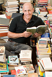 David Lubin in stacks of books