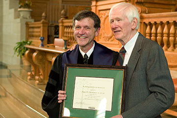 The Rev. Ed Christman (right), former University Chaplain, receives the Divinity School's Distinguished Service Award from Dean Bill Leonard.