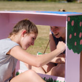 Wake Forest students paint desks for local elementary school students at the annual volunteer service project DESK, on Poteat Field on Wednesday, April 10, 2019.