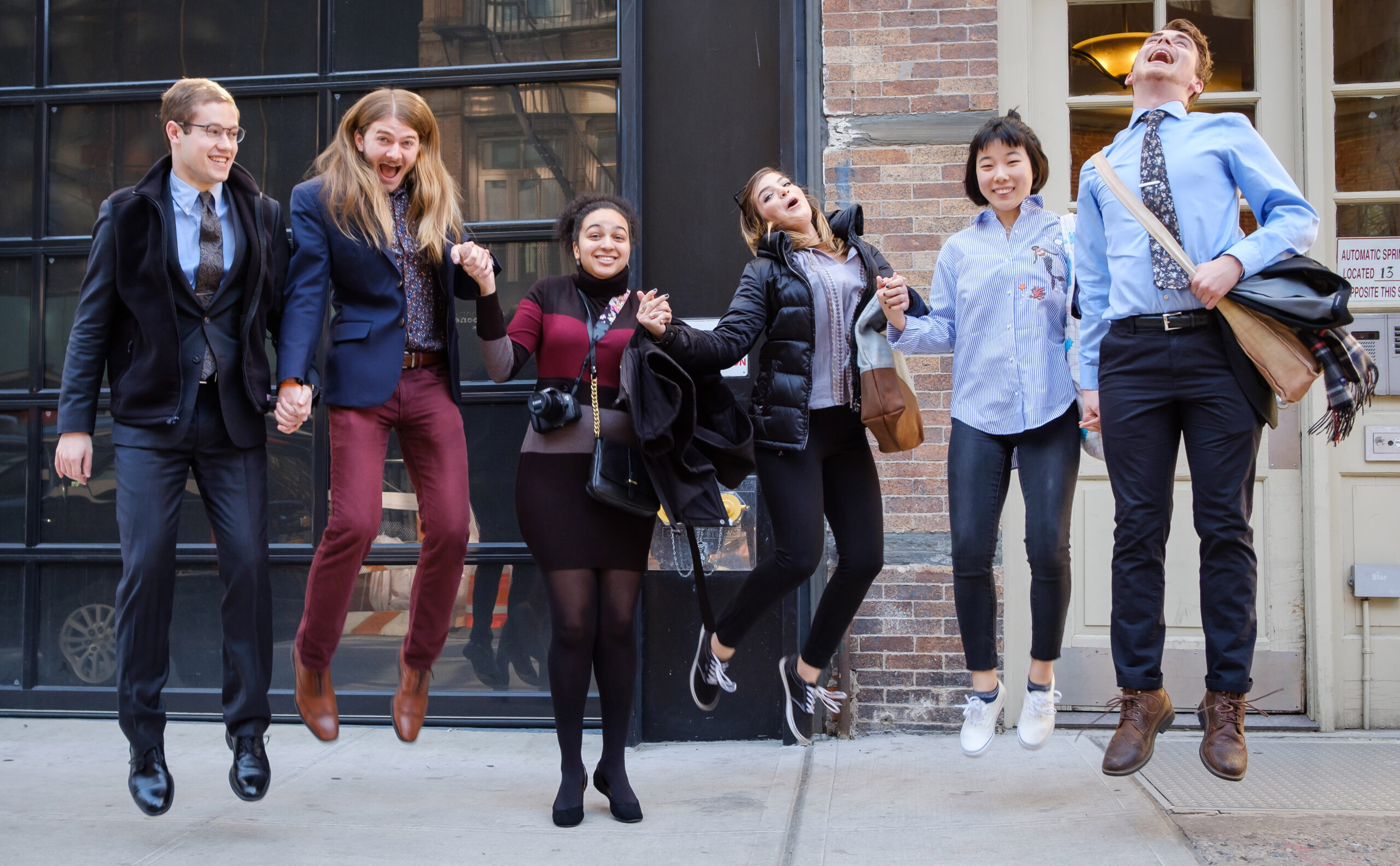 Student on the art-buying trip celebrate in New York in 2017.