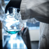 scientist holding a beaker.