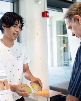 Jose Toscano Ventura talks with physics professor Dany Kim-Shaprio about his research.