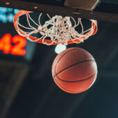 Basketball going through a hoop during a game