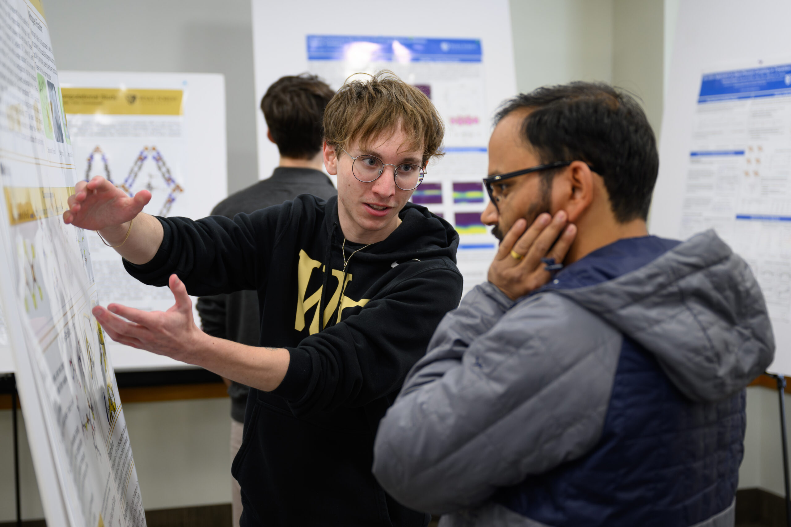 Wake Forest University student and faculty attend the Center for Functional Materials 2nd Annual Research Day in the Benson University Center on Friday, November 22, 2024. The CFM Research Day aims at promoting research discussions and networking among members of the Center for Functional Materials (CFM) with shared research interest in materials as well as researchers and industry players in the materials sector.   Physics major Chris Fivecoat ('25) talks about his research.