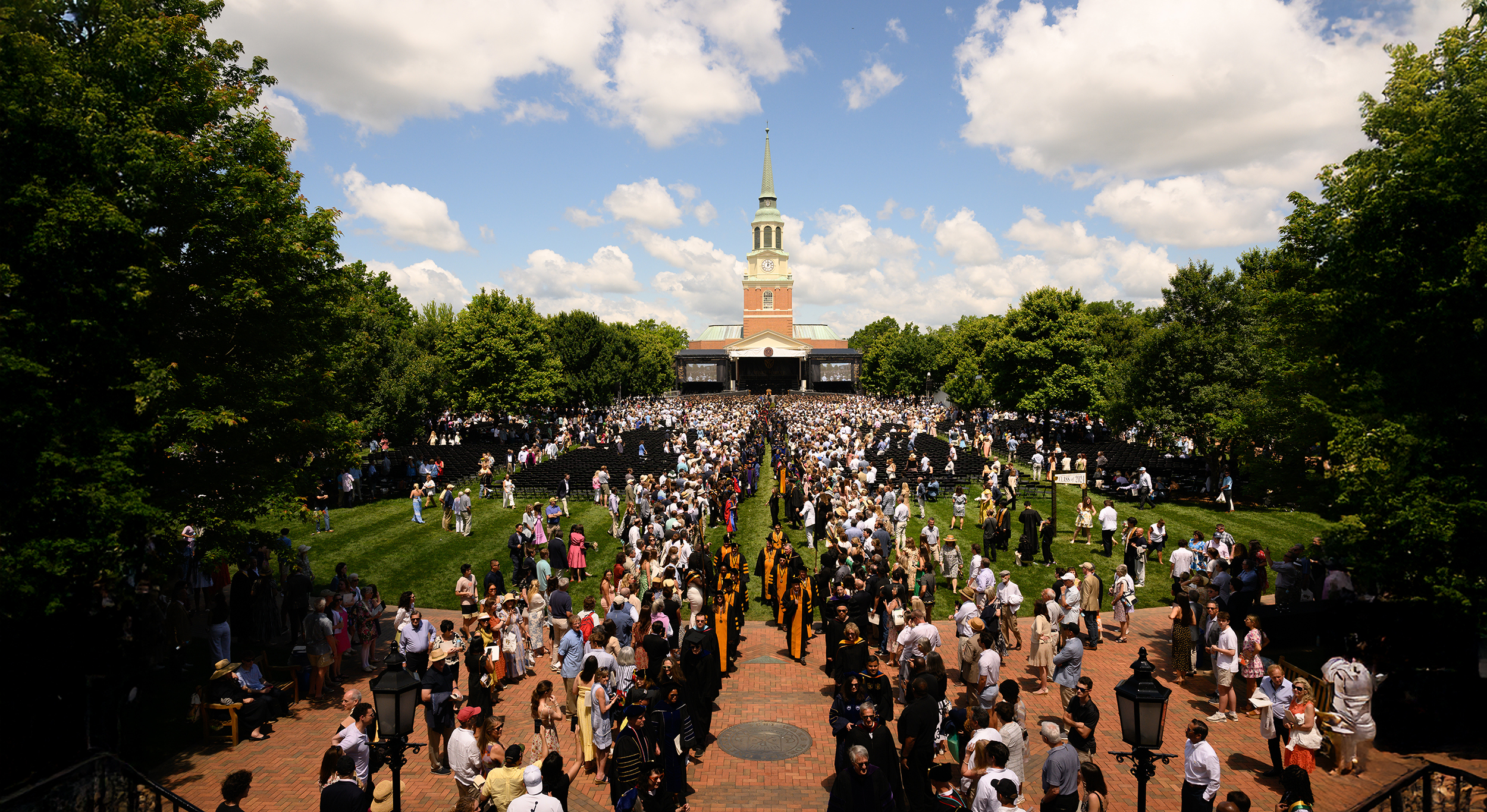 Wake Forest University students, family, friends, faculty, and staff attend the Commencement Ceremony on Hearn Plaza on Monday, May 20, 2024. The students lined up on the Mag Quad and then processioned onto Hearn Plaza.