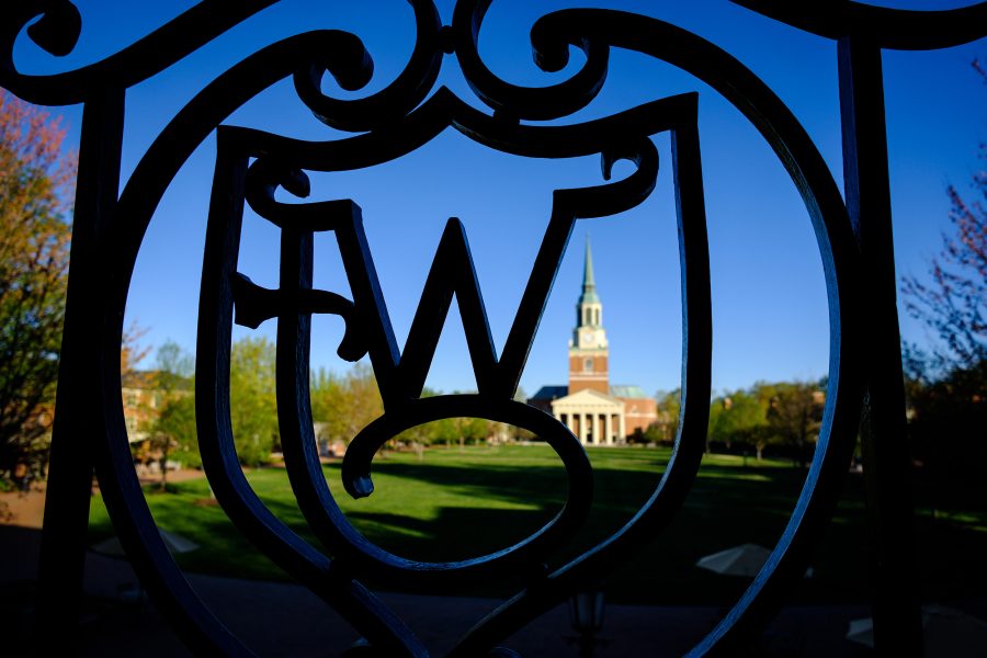 The WF ironwork on Reynolda Hall frames Wait Chapel in the early morning light, on the campus of Wake Forest University on Wednesday, April 10, 2019.