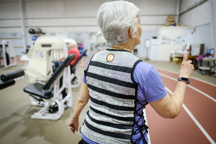 Wake Forest Health and Exercise Science professor Kristen Beavers works with study participant Kaye Brandon at the Clinical Research Center, on the campus of Wake Forest University, Friday, January 17, 2020. The study is looking at whether wearing a weighted vest will prevent bone density loss among older adults who are losing weight for health reasons.