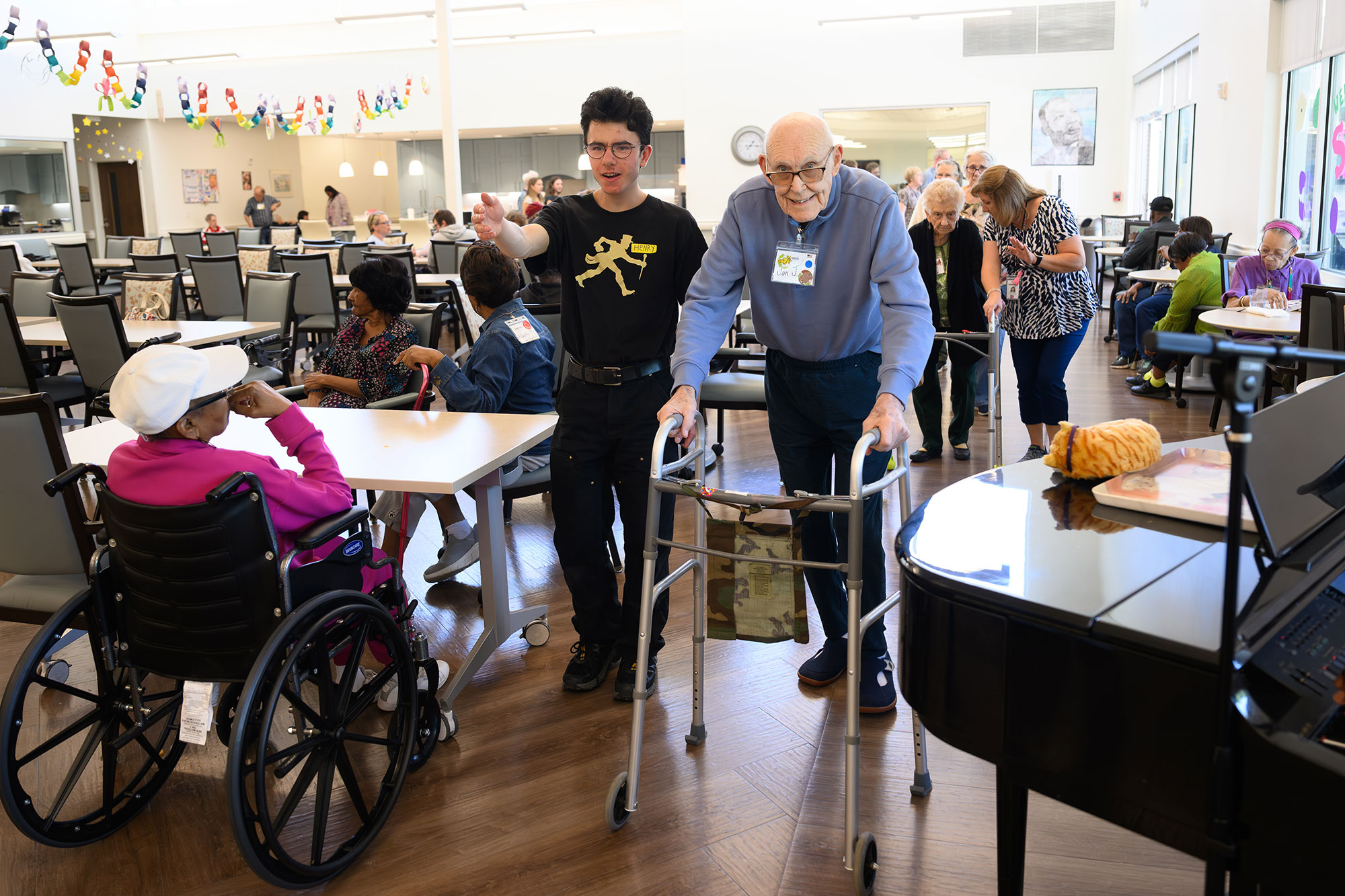 Visits to the Williams Center, housed in the Intergenerational Center for the Arts and Wellness, include exercise – a walk around the activity room.
