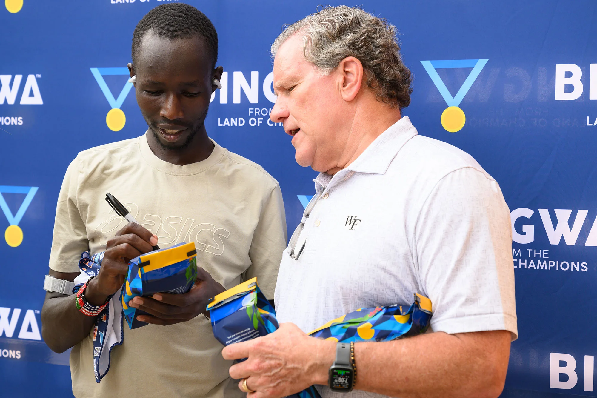 Wake Forest professor Peter Brubaker joins marathoner John Korir for a fundraising event at Fleet Feet Winston-Salem.