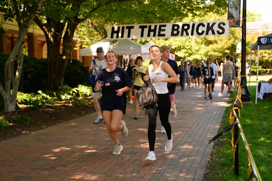 Wake Forest University students, faculty, staff, and alumni walk and run the brick pathway around Hearn Plaza as part of the annual Hit the Bricks event on Thursday, October 1, 2026.