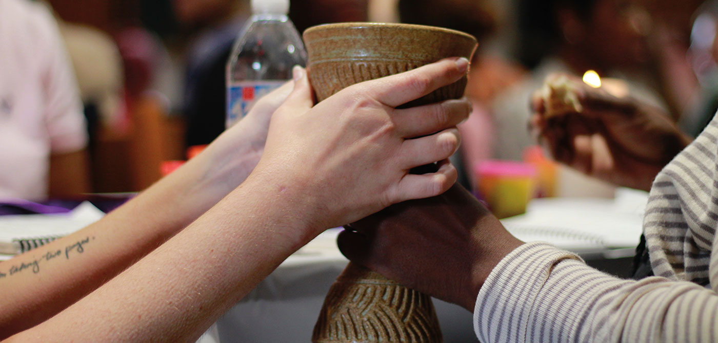 School of Divinity students share communion during a Community Worship service in Davis Chapel.