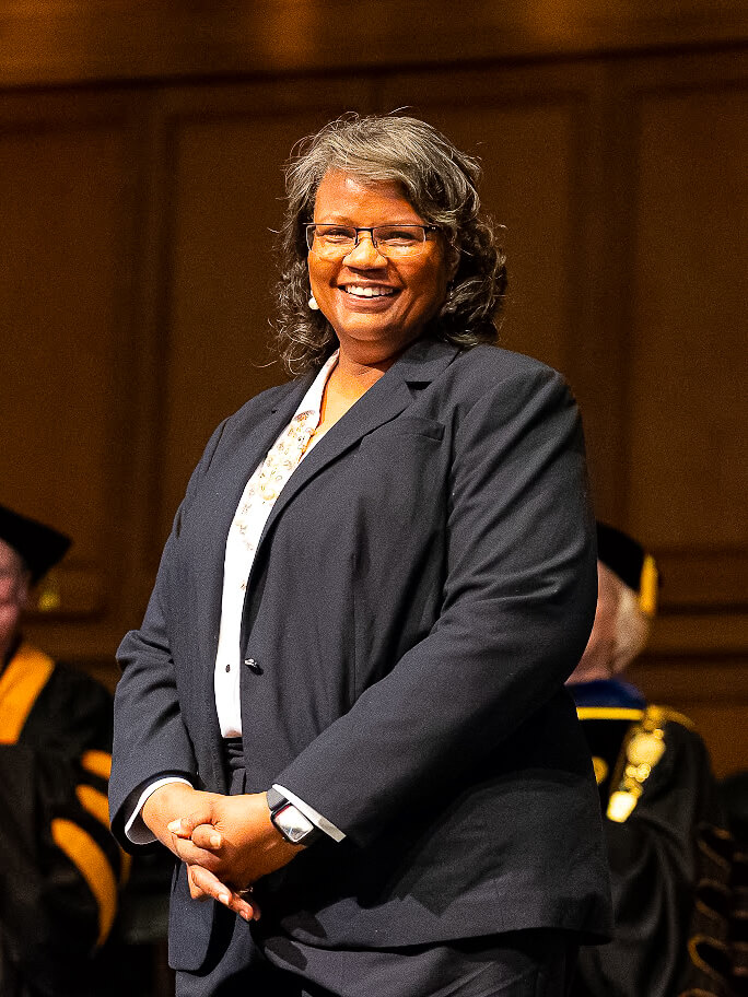 Rev. Dr. Emma Jordan-Simpson stands to receive the Bill J. Leonard Award 2025