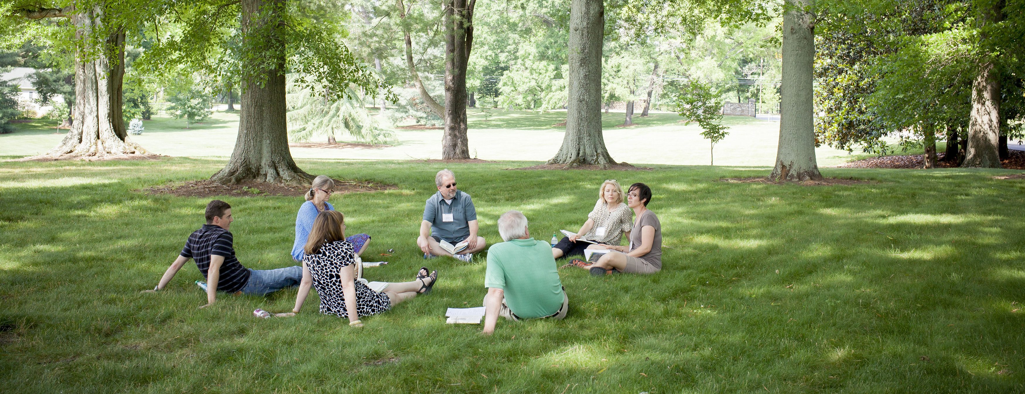 faculty outside on grass