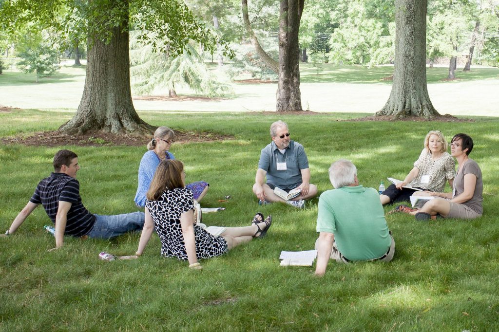 faculty outside on grass