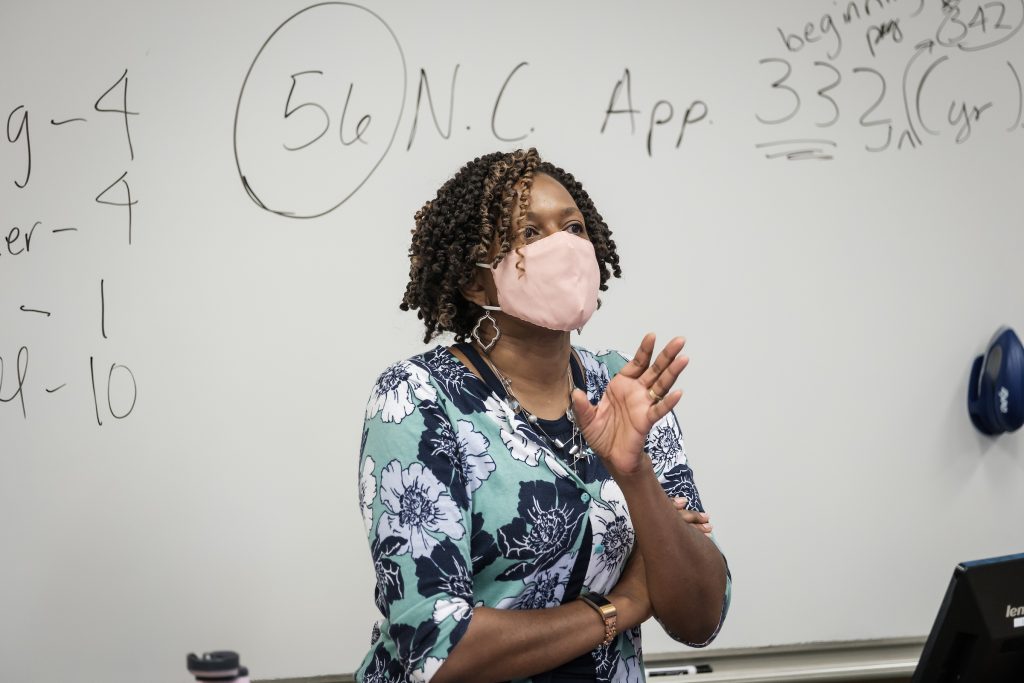 professor teaching in mask